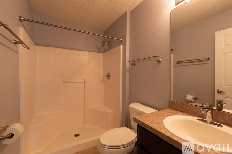 A bathroom with a toilet, sink, and bathtub.