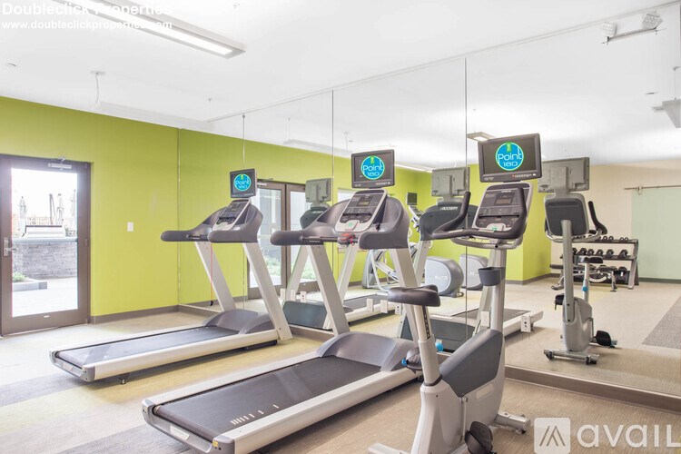 A gym with treadmills and exercise bikes.