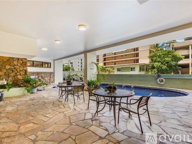 A patio with a table and chairs is shown.