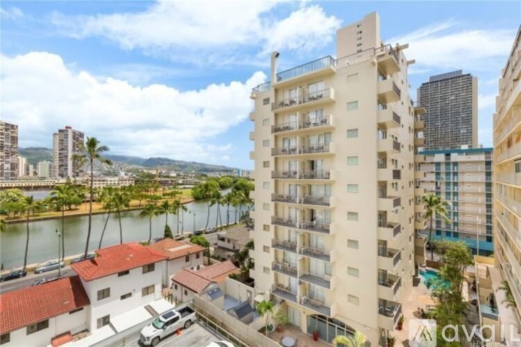 A small bathroom with a white sink and a white bathtub.