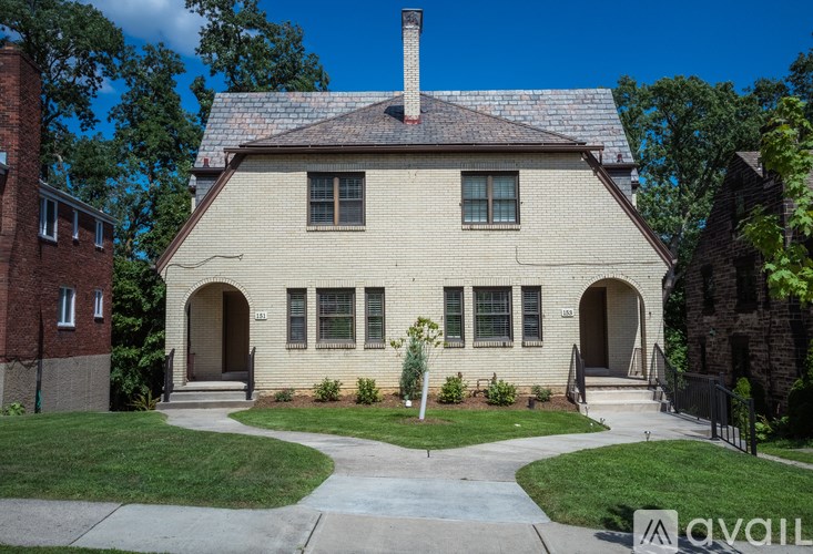 A house with a brick chimney and a porch.