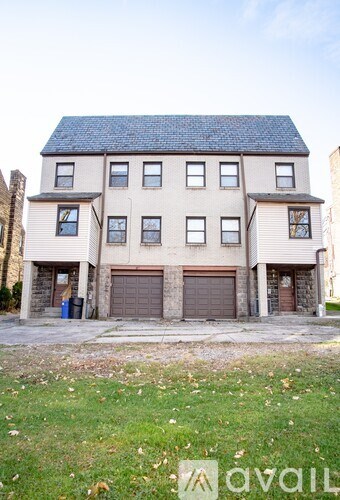 A two-story building with a garage is available for rent.