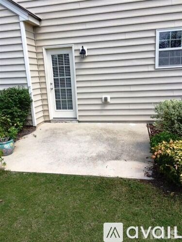 A house with a white door and a window.