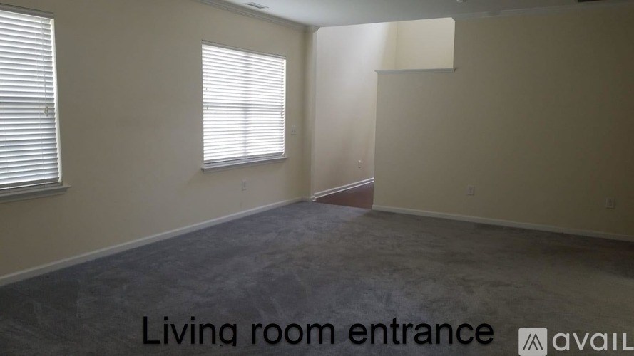 A living room entrance with a window and a door.