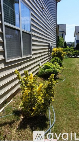 A house with a hose in front of it.