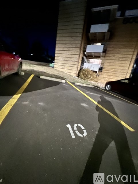 A parking lot with the number 10 painted on the ground.