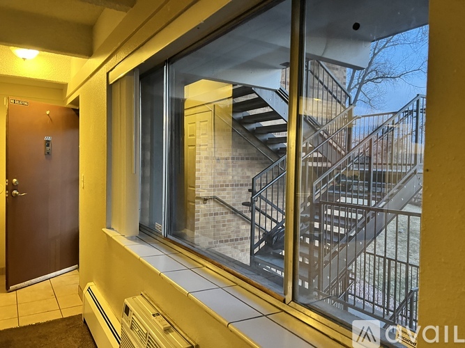 A view of a staircase from a window in a building.