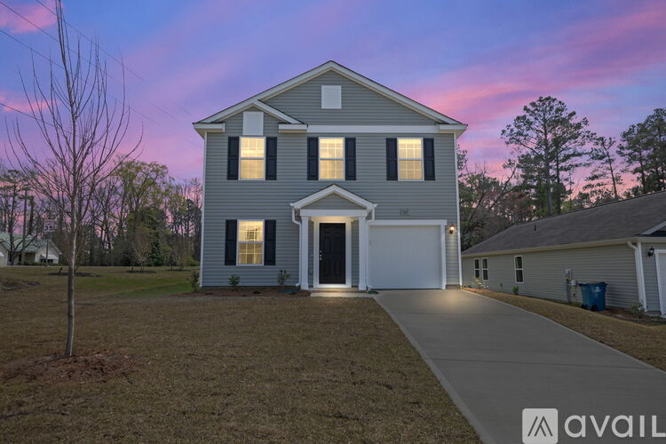 A house with a garage is available for sale.