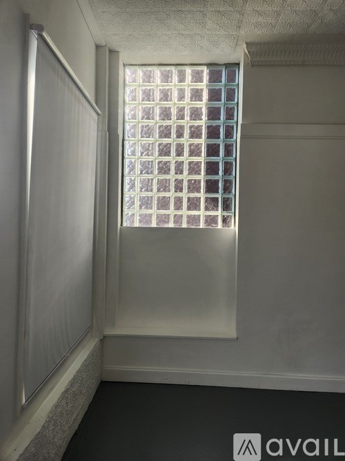A window with a white frame and a grid of square panes.
