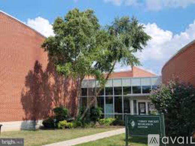 A building with a green sign in front of it.