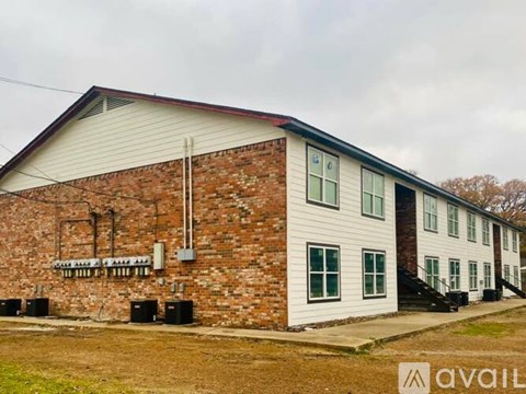 A building with a sign that says "AVAILABLE" on the front.