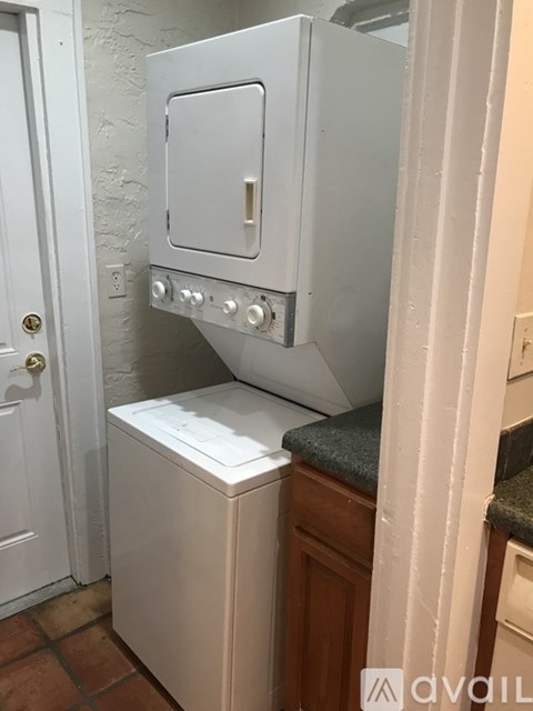 A white oven and dishwasher in a kitchen.