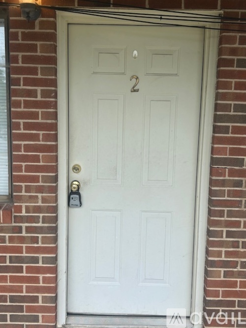 A white door with the number 2 on it.