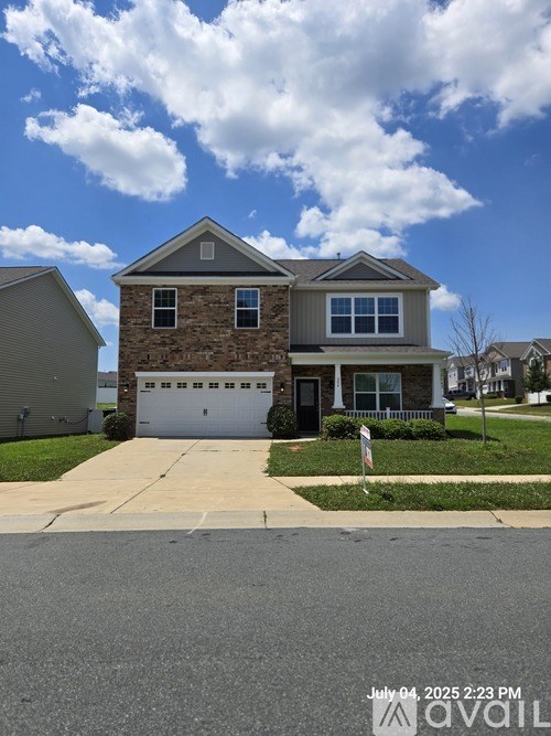 A house with a garage is shown in the image.