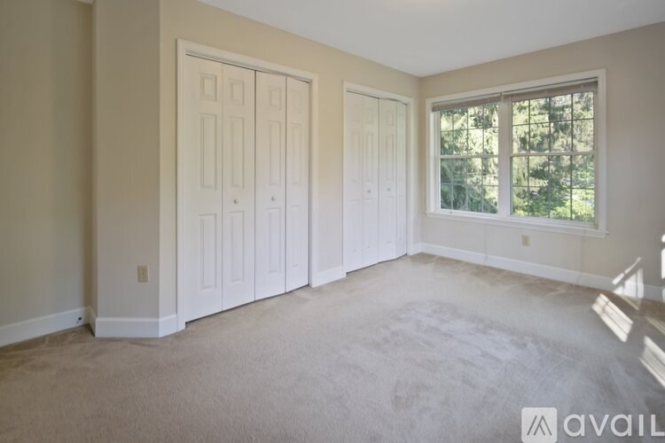 A room with two doors and a window.