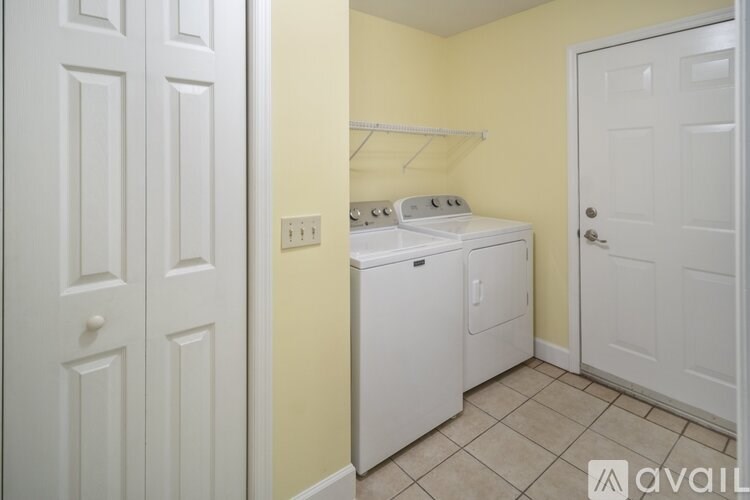 A laundry room with a washer and dryer.
