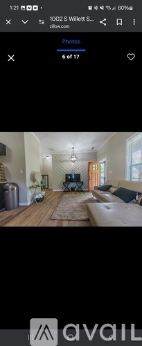 A living room with a couch and a television.