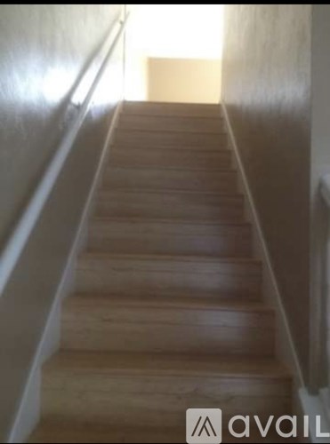 A flight of wooden stairs leading upwards.