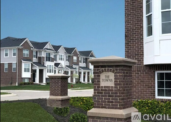 A row of houses with a sign that says "The Town".