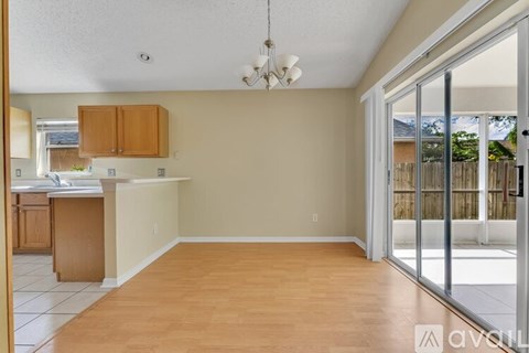 A kitchen with wooden cabinets and a white countertop.