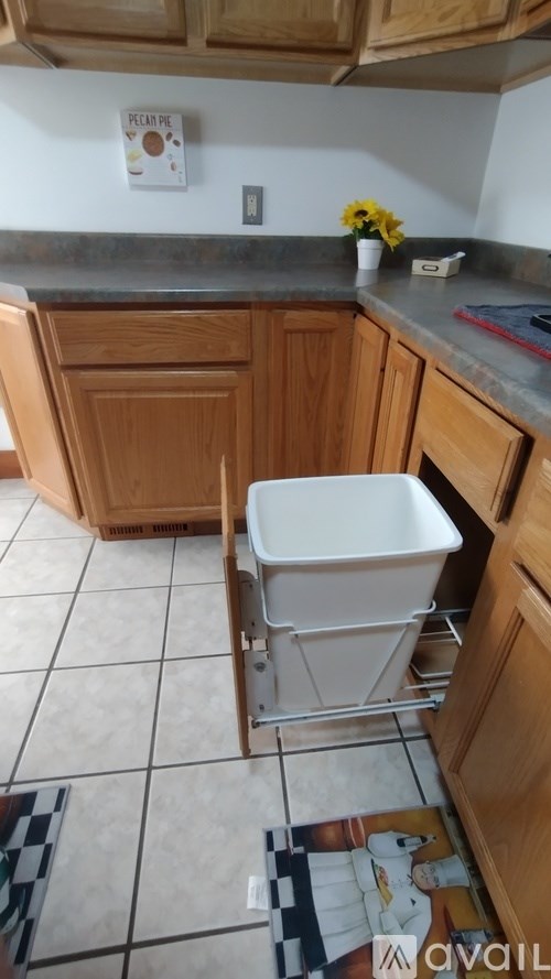 A wooden cabinet with open shelves and drawers.