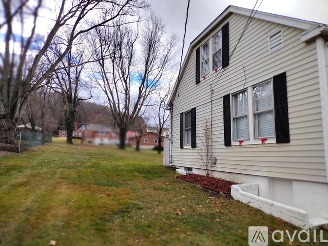 A house with a lawn in front of it.