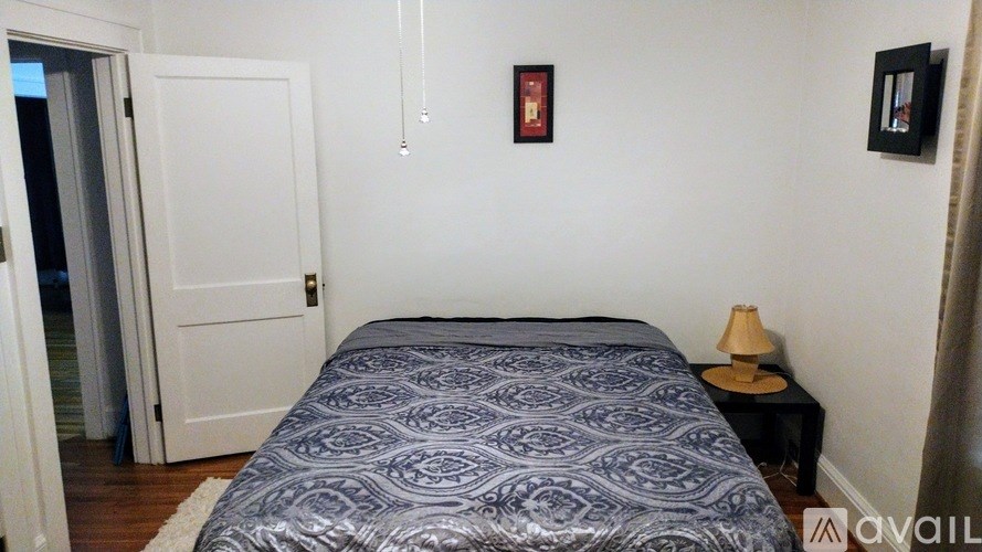 A small house with a red cross on the window.