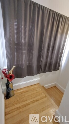 A room with a bed and a shelf in it.