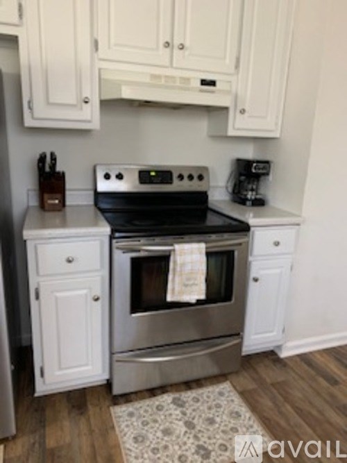 A kitchen with a stove and oven.