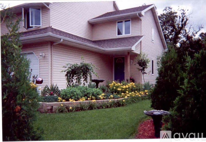 A house with a garden in front.