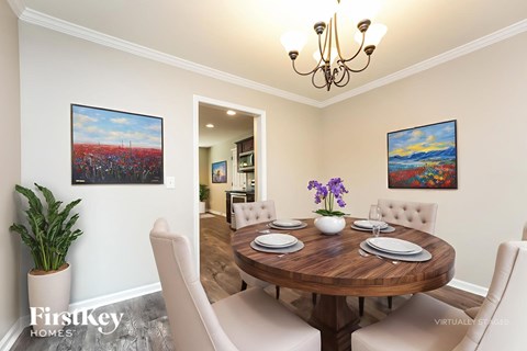 A dining room with a wooden table set for six.