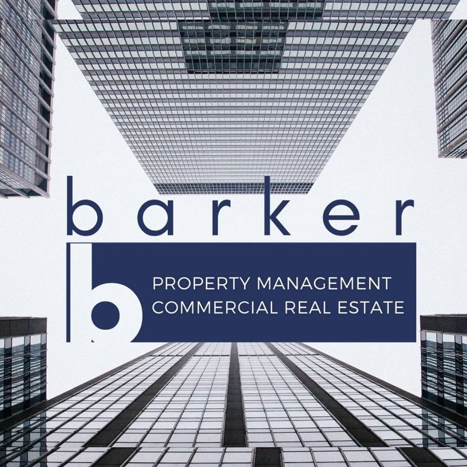 A logo with the text "barker" and "property management commercial real estate" in front of a cityscape.