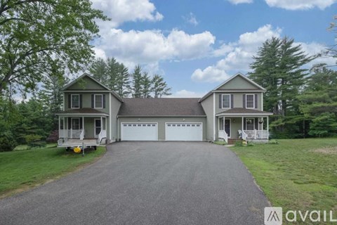 A house with a driveway in front of it.