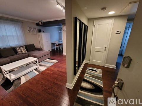 A living room with a couch and a coffee table.
