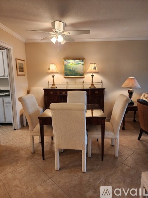 A dining room with a table set for four.