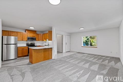 A kitchen with wooden cabinets and a white countertop.