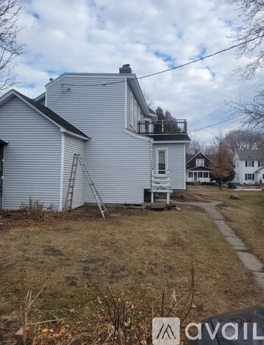 A house with a ladder in front of it.