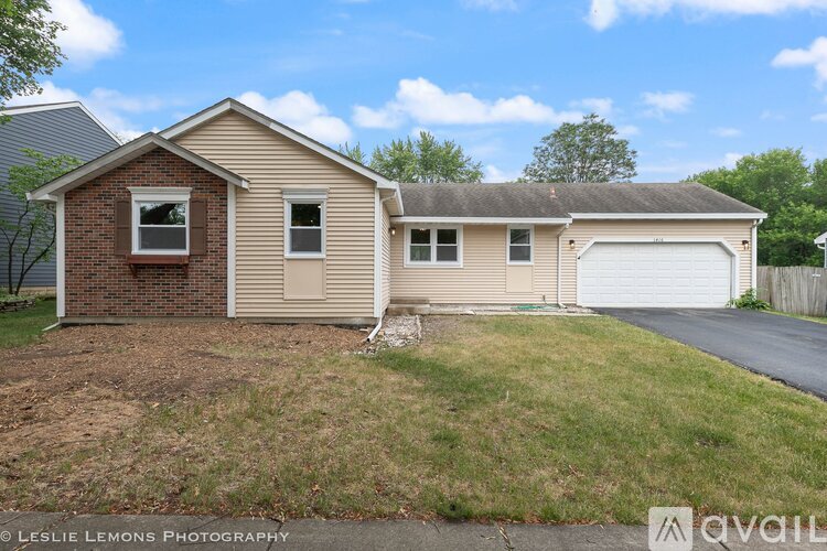 A house with a garage is for sale.