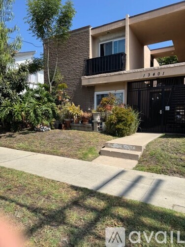 A house numbered 13401 is shown with a front yard and a black gate.