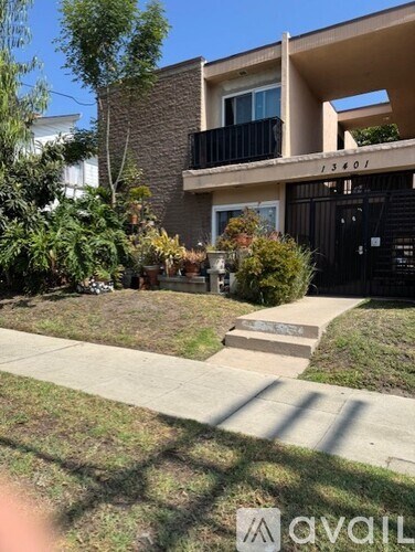 A house numbered 13401 is shown with a front yard and a black gate.