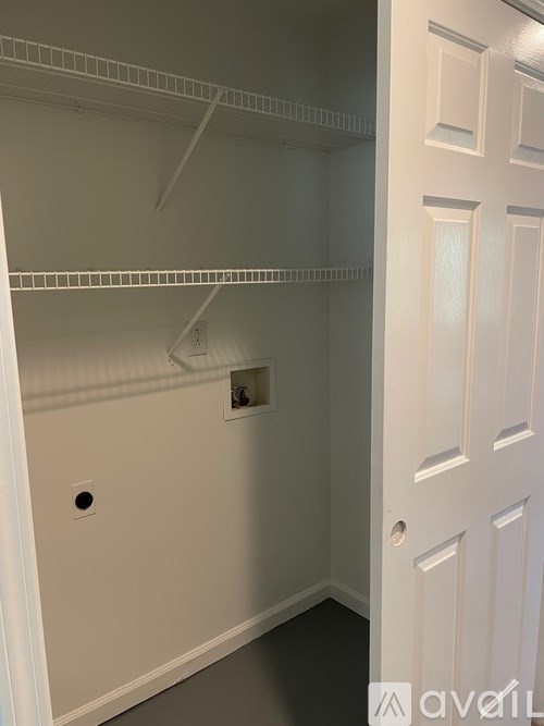 A white door is on the right side of the image.