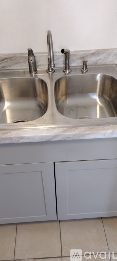 A kitchen with a sink and a countertop.