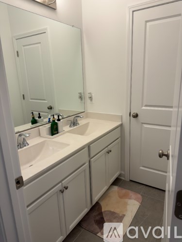 A bathroom with a sink and mirror.