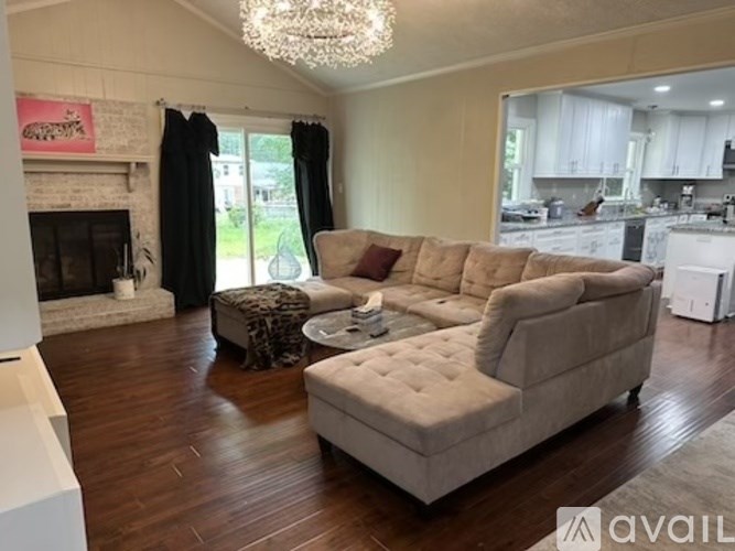 A living room with a fireplace and a couch.