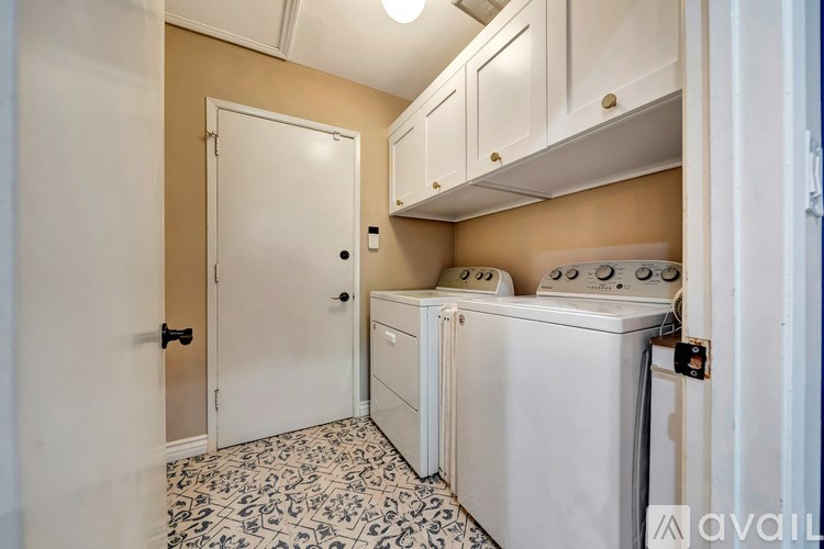 A laundry room with a washer and dryer.