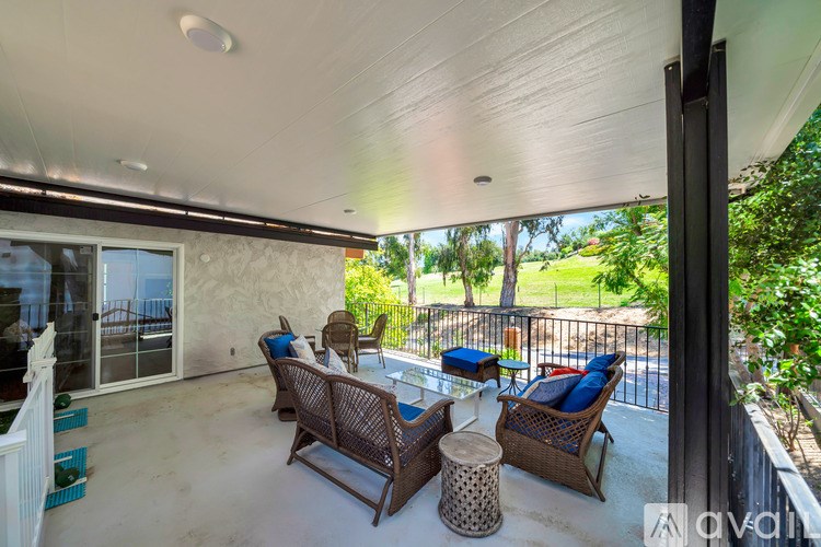 A patio with a table and chairs is shown.