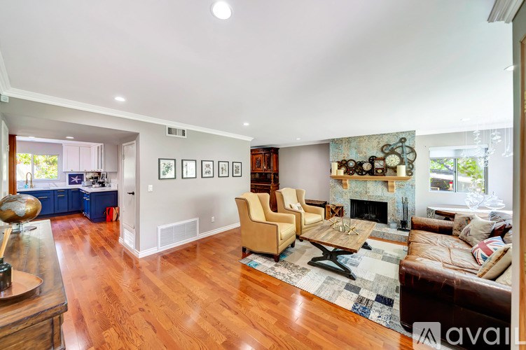 A living room with a fireplace and a couch.