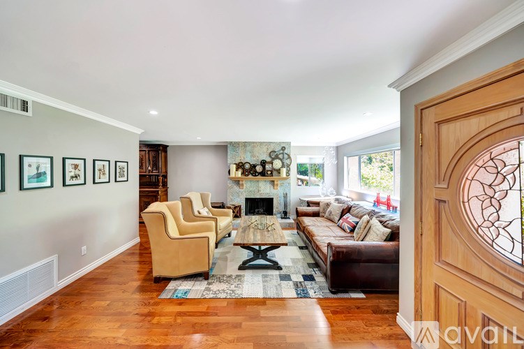 A living room with a fireplace and a couch.