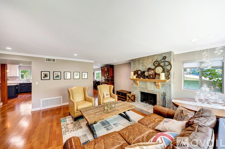 A living room with a fireplace and a couch.