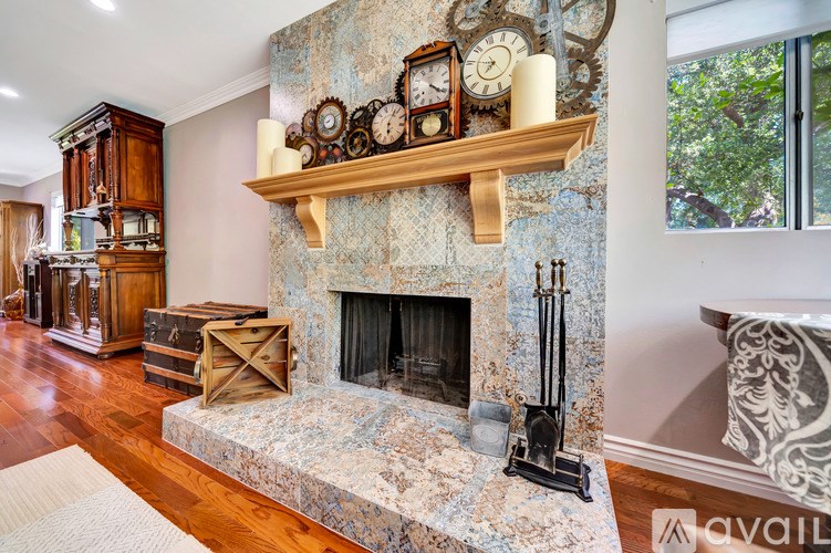 A fireplace with a clock on top of it.